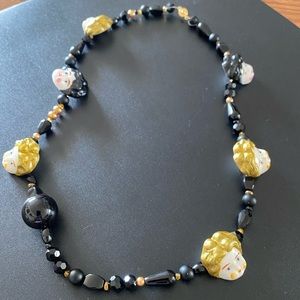 Unlogical Poem big doll head necklace.